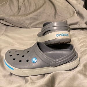 Grey and blue crocs